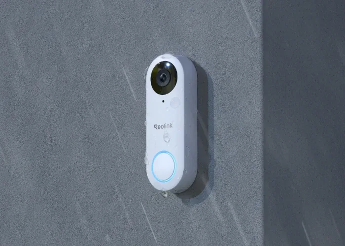 White Reolink Video Doorbell PoE mounted on an exterior wall in manufacturer imagery