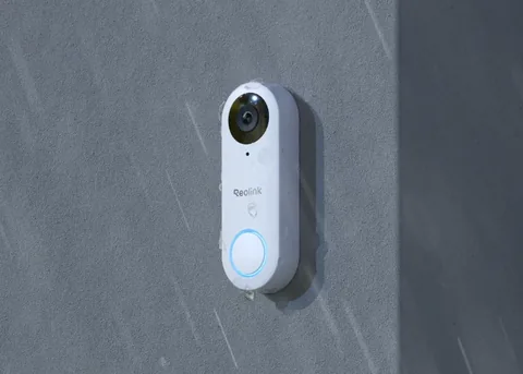 White Reolink Video Doorbell PoE mounted on an exterior wall in manufacturer imagery