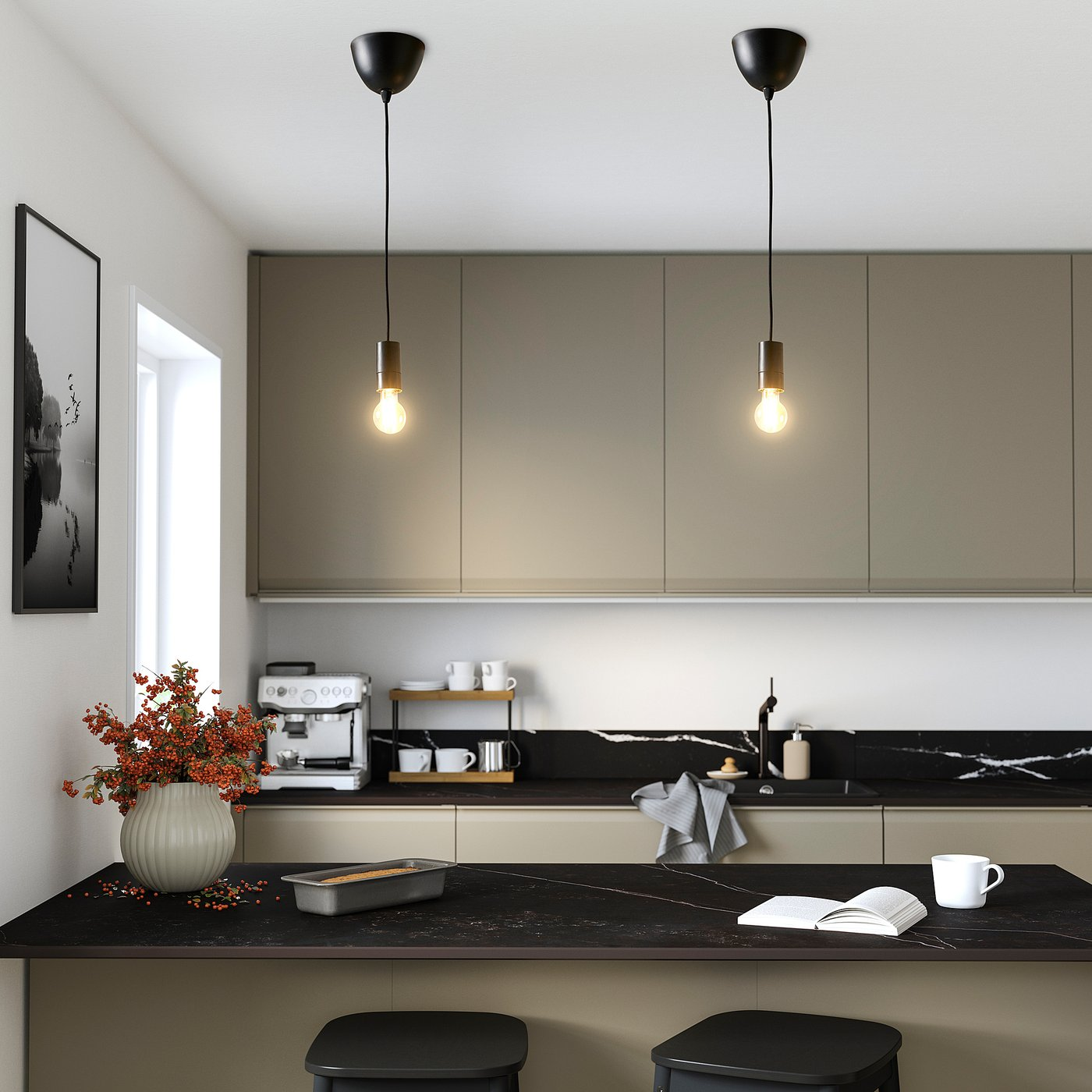 Two real IKEA KAJPLATS clear smart bulbs glowing above a warm residential kitchen counter